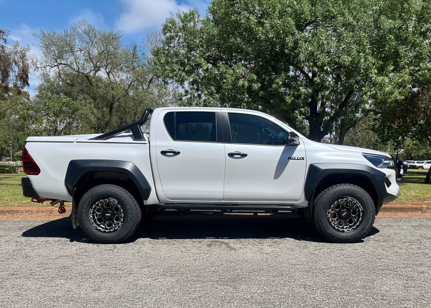 2025 GR Sport Hilux with H1-HEX LFT Wheels side angle 4x4