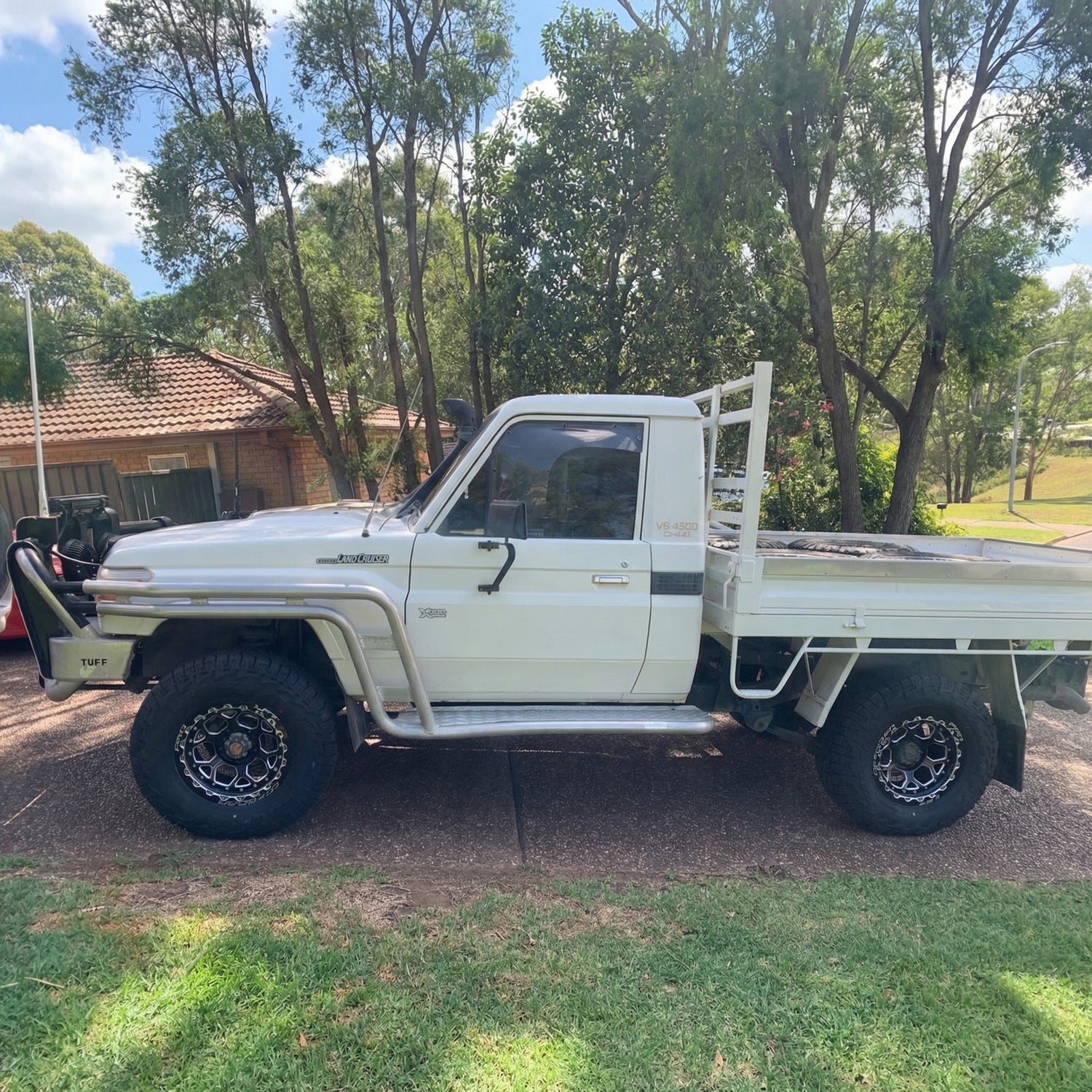 2016 Toyota 79 Series Land Cruiser with H1-HEX LFT Wheels side angle 4x4 17x9 -12mm offset WHite