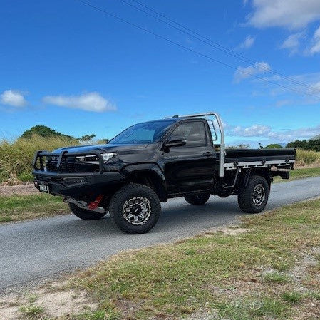 2025 Toyota Hilux with M1-MOTION LFT Wheels side angle 4x4 17x9 0mm offset Black Single Cab